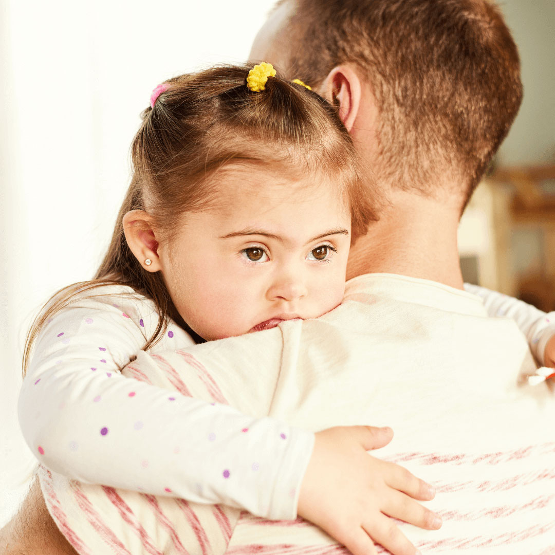 Little girl hugging her dad.