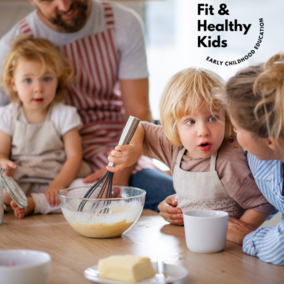 Two children with two adults in aprons cooking