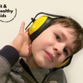 Young boy wearing yellow headphones