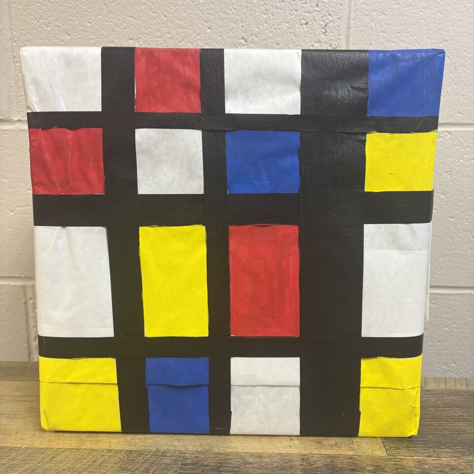 Square with red, yellow, blue and white squares outlined in black