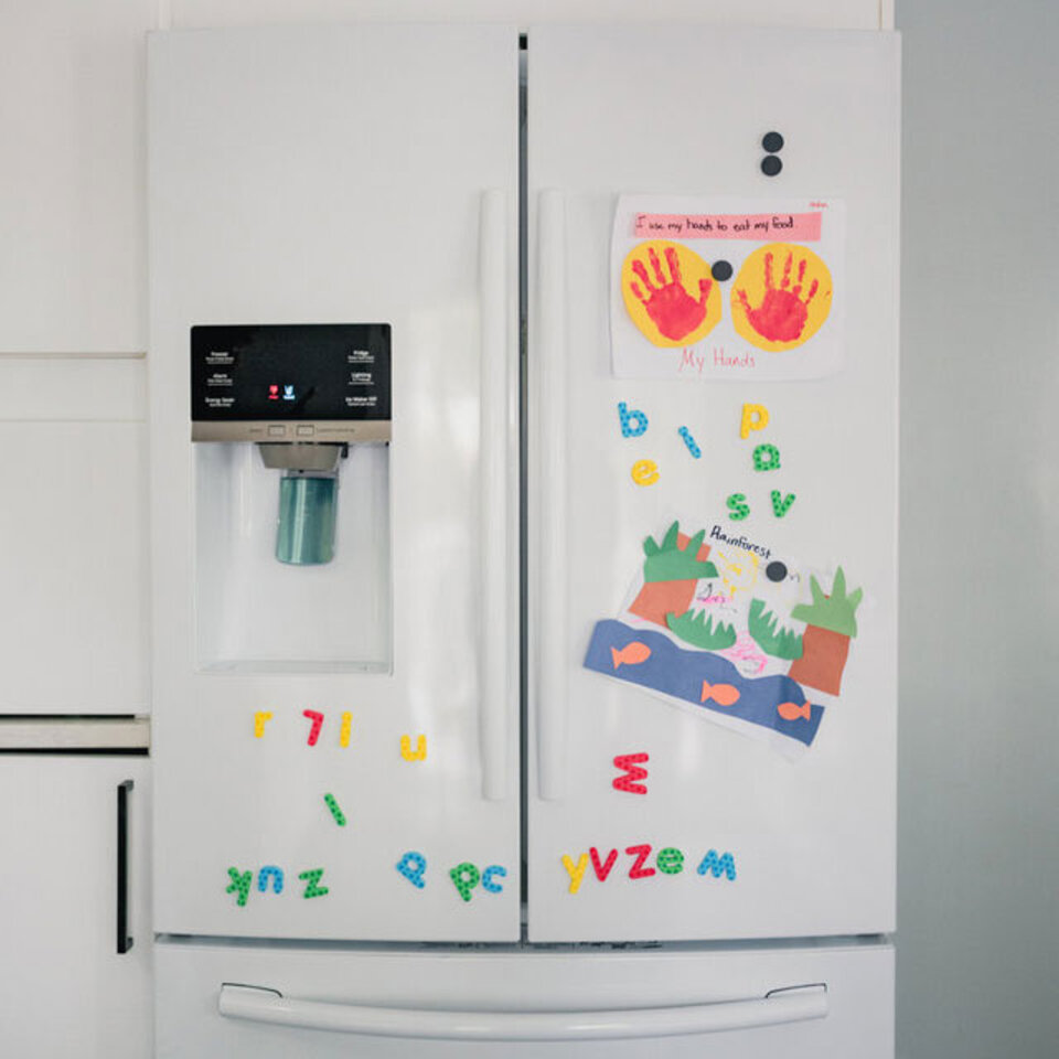 Refrigerator with art on it.