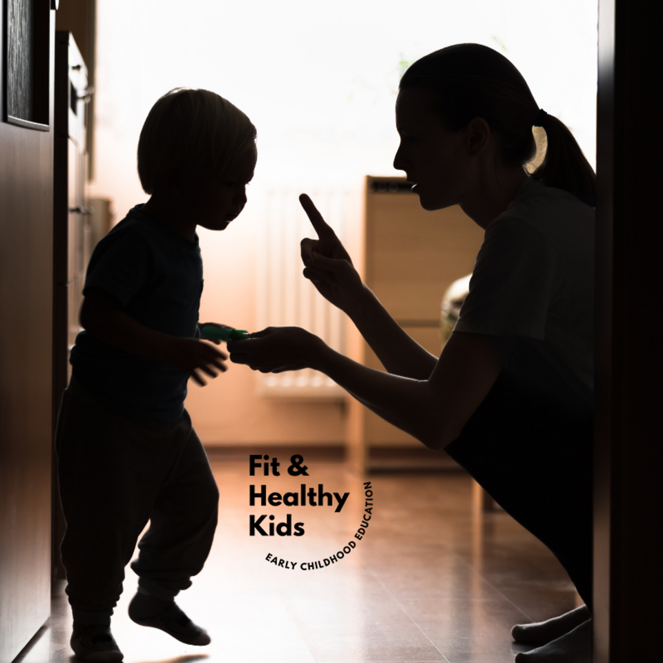 Shadow of woman and child and the woman is holding up her pointer finger