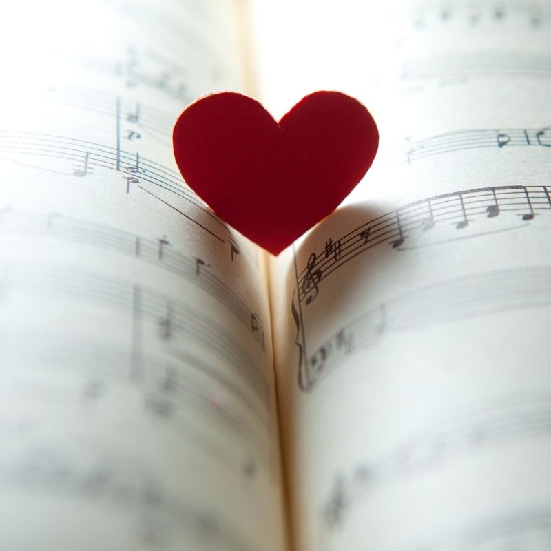 sheet music with a red heart